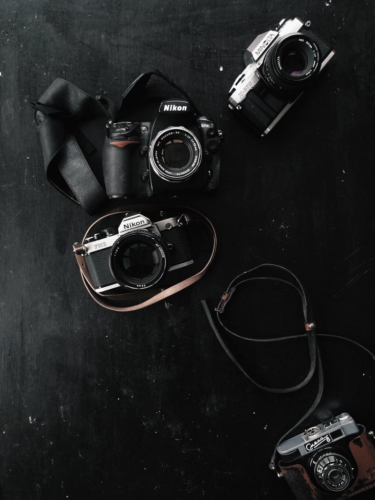 Three Black and Gray Dslr and Slr Cameras